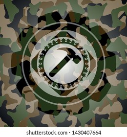 hammer icon on camo pattern