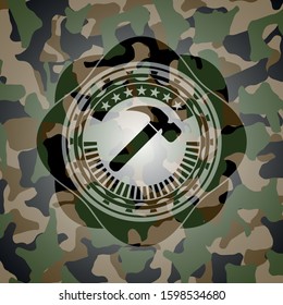 hammer icon on camouflage texture