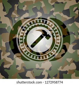 hammer icon on camouflaged pattern