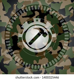 hammer icon on camouflaged pattern