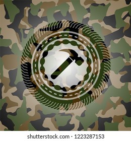 hammer icon on camouflaged texture