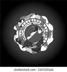 hammer icon on grey camo pattern