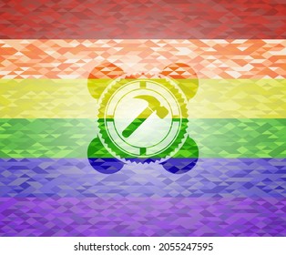 hammer icon on mosaic background with the colors of the LGBT flag. 