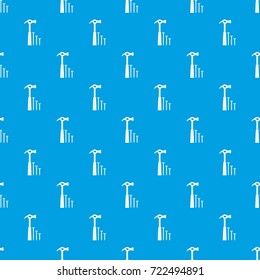 Hammer and nails pattern repeat seamless in blue color for any design. Vector geometric illustration