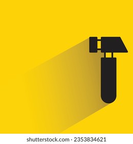 hammer with shadow on yellow background