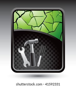 hammer and tools on green cracked background