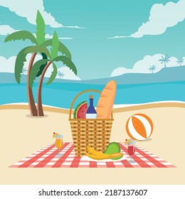 Hamper with juice bottles and fruits with bread on sunny beach