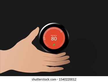 hand adjusting the temperature on modern circle thermostat, Heat set to 80 Fahrenheit , Heater adjustment in cold season