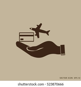 hand and airplane ticket. 