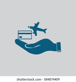 hand and airplane ticket. 