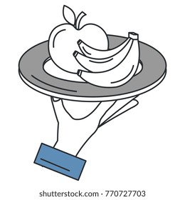hand with apple and banana in dish