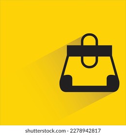 bolso de mano con sombra sobre fondo amarillo
