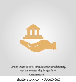 Hand and bank building. Vector. Bank building icon.