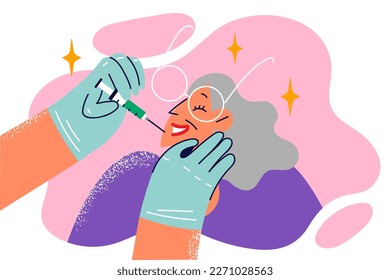 Hand of beautician with syringe filled with Botox intended for elderly woman who wants to get rid wrinkles. Gray-haired old female undergoes rejuvenation procedure in cosmetology clinic using botox 