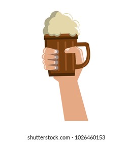 Hand with beer on wooden cup