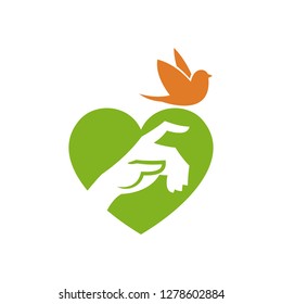 Hand and bird on heart shape background
