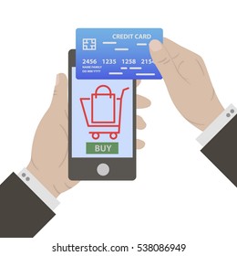 Hand with blue credit card for payment. Mobile payment. Hand holing smart phone with buy button and basket on screen. E-commerce flat design concept. Using mobile smart phone for online purchasing.