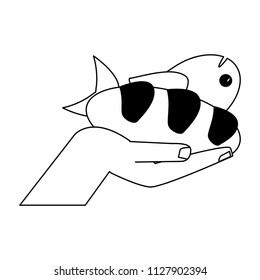 Hand with bread and fish in black and white