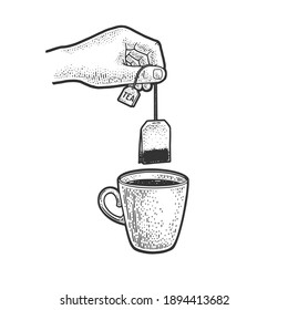hand brews tea bag in cup sketch engraving vector illustration. T-shirt apparel print design. Scratch board imitation. Black and white hand drawn image.