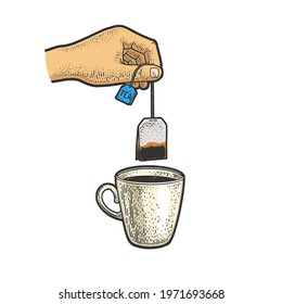 hand brews tea bag in cup color sketch engraving vector illustration. T-shirt apparel print design. Scratch board imitation. Black and white hand drawn image.