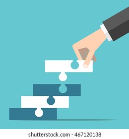 Hand building staircase with steps made of puzzle pieces. Progress, growth, strategy and achievement concept. EPS 8 vector illustration, no transparency