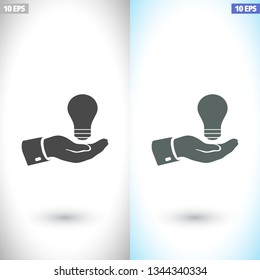 hand and bulb. icon. Vector Eps 10