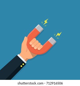 Hand of a businessman with magnet. Business concept of the attraction of money, customers and investment. Vector illustration in a flat style.