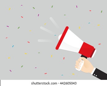 hand of businessman or manager announced by megaphone. advertising through loudspeaker with confetti falling