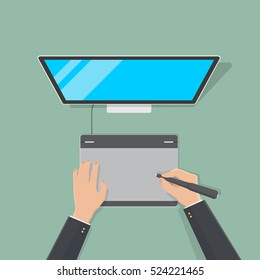 hand of businessman use pen mouse with monitor desktop computer