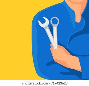 Hand of car mechanic with wrench. Auto repair garage.