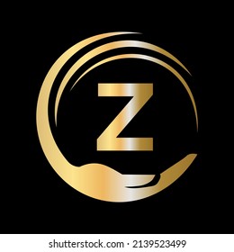 Plantilla De Logotipo De Cuidado De La Mano En La Letra Z. Signo inicial de la Fundación de Caridad de Unidad. Diseño del logotipo de trabajo de equipo de Unity con plantilla de letra Z