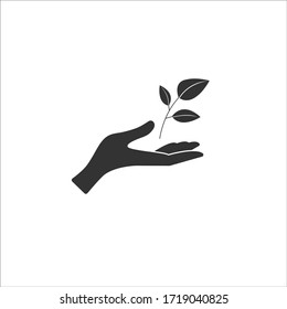 Hand carefully holds a sprout of a tree with leaves. Vector icon, black silhouette, flat design.