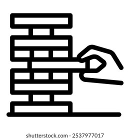 Hand is carefully removing a block from a tall tower of wooden blocks