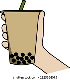 hand carrying a glass of thai tea with boba topping