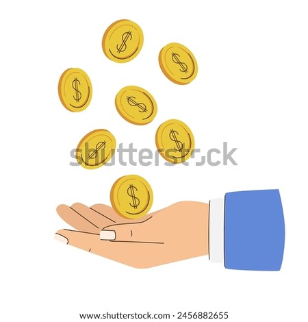 A hand is catches falling gold coins