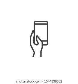Hand with cell phone line icon. linear style sign for mobile concept and web design. Hand holding smartphone outline vector icon. Symbol, logo illustration. Vector graphics