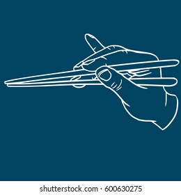 Hand with chopsticks