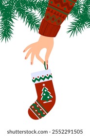 Hand in Christmas sweater holding gift sock. Funny holiday illustration in flat style. Vector image.