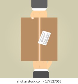 From hand to hand. Close-up of hands holding cardboard box. Hands to receive a parcel