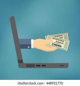 Hand coming out of the laptop with cinema tickets on the blue background.