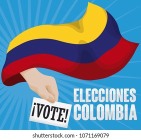 Hand coming out from waving Colombian flag ready to vote in Colombia's Election event (written in Spanish).