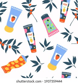 Patrón impecable de la belleza de la crema de mano. Tubos y botellas coloridas, hojas, bayas, accesorios para mujeres. Producto de belleza de la humedad en un entorno aislado.