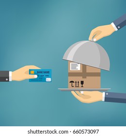 Hand with credit card and hands with parcel on the cloche.