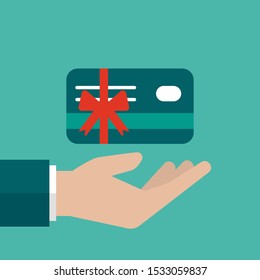 Hand with credit debit card with red bow and ribbon. Vector flat illustration on blue. Give, receive, take, earn money. Financial success, salary, investment, dividend. Gift card icon. Bank present 