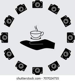 Hand and cup of tea vector icon