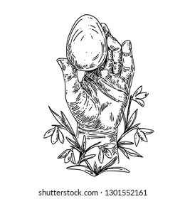 Hand decorated with snowdrops holding an Easter egg. Sketch. Engraving style.