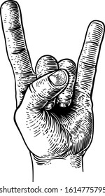 A hand doing a heavy metal rock music sign gesture in a vintage woodcut retro style