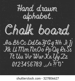 Hand drawin alphabet handwritting abc font on blackboard. Italic light thin line type letters, numbers and punctuation marks