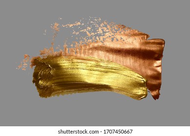 hand drawing gold brush stroke paint spot on a gray background, handmade vector illustration
