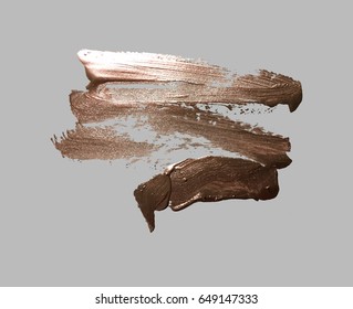 hand drawing gold brush stroke paint spot on a gray background, handmade vector illustration